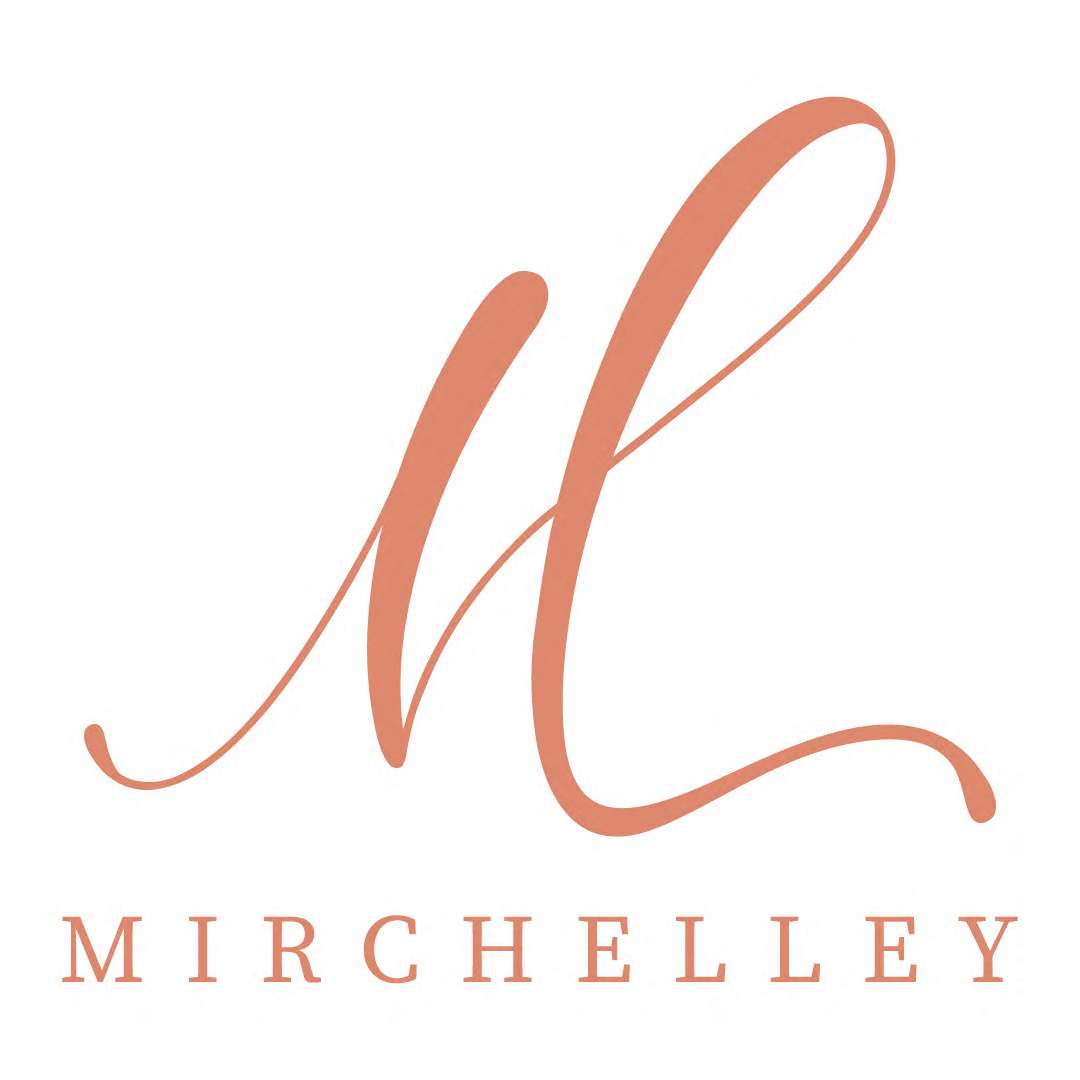 Large cursive M above the word MIRCHELLEY in uppercase letters.